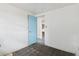 View of empty bedroom with access to an adjoining room and an old laminate floor at 114 Spring Lake Cir, Ocoee, FL 34761