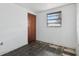 Empty bedroom featuring laminate floors, a window, and a closet for storage space at 114 Spring Lake Cir, Ocoee, FL 34761