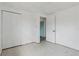 Empty bedroom with large closet, adjoining room, and vintage tiled floor at 114 Spring Lake Cir, Ocoee, FL 34761