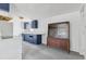 The kitchen features blue cabinets, white appliances, and a built-in display cabinet at 114 Spring Lake Cir, Ocoee, FL 34761