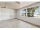 Spacious room with a large window overlooking lush greenery and natural light at 114 Spring Lake Cir, Ocoee, FL 34761