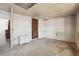 Unfurnished room featuring a built-in cupboard, old interior door, and concrete floor at 114 Spring Lake Cir, Ocoee, FL 34761