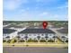 Desirable community featuring townhomes with inviting exteriors, well-manicured landscaping, and ample parking at 11607 Sunsail Ave, Orlando, FL 32832