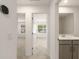 Hallway with views into the bedroom and bathroom, showcasing the home's layout and design at 11607 Sunsail Ave, Orlando, FL 32832
