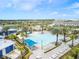 Aerial view of the resort-style pool, showcasing ample lounge chairs and a Gathering play area at 11607 Sunsail Ave, Orlando, FL 32832
