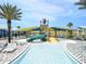 View of the community water park featuring a slide, covered seating and lounge chairs at 11607 Sunsail Ave, Orlando, FL 32832