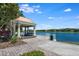 Picturesque gazebo overlooking a tranquil lake with comfortable seating and stunning views at 11908 Fiore Dr # 1, Orlando, FL 32827