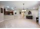 Open-concept living area with tile flooring, recessed lighting, and seamless flow to the kitchen and dining spaces at 11908 Fiore Dr # 1, Orlando, FL 32827