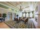 Elegant lounge featuring coffered ceilings, chandeliers, fireplace, and comfortable seating arrangements at 11908 Fiore Dr # 1, Orlando, FL 32827