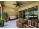 Inviting covered patio with ceiling fan, comfortable seating, and a view of the outdoors at 11908 Fiore Dr # 1, Orlando, FL 32827