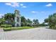 Charming town center featuring a clock tower, lush landscaping, and inviting streetscape at 11908 Fiore Dr # 1, Orlando, FL 32827