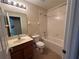 Bathroom with a single sink vanity, tub with shower, and tile flooring at 135 Heritage Park St, Winter Springs, FL 32708