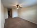 Neutral bedroom with ceiling fan, carpeted floors, and a spacious closet at 135 Heritage Park St, Winter Springs, FL 32708