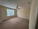 Bedroom with a ceiling fan, neutral walls, and a window with blinds at 135 Heritage Park St, Winter Springs, FL 32708