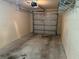 Garage featuring a traditional garage door and concrete floor at 135 Heritage Park St, Winter Springs, FL 32708