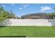 Fenced backyard offers privacy and features lush green grass and pool views for outdoor fun at 1545 Caterpillar St, St Cloud, FL 34771