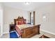 Spacious bedroom featuring wood furniture, a ceiling light, and a window that lets in natural light at 1545 Caterpillar St, St Cloud, FL 34771
