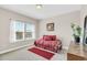 Bright bedroom featuring a daybed, large window, and neutral walls, creating a serene retreat at 1545 Caterpillar St, St Cloud, FL 34771