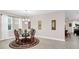 Dining room featuring a glass table, ornate chairs, chandelier and window at 1545 Caterpillar St, St Cloud, FL 34771