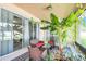 Relax on the lanai with cozy seating and vibrant greenery, creating a peaceful outdoor retreat at 1545 Caterpillar St, St Cloud, FL 34771