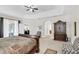 Spacious main bedroom featuring tray ceiling and neutral tones at 1545 Caterpillar St, St Cloud, FL 34771