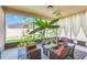 Enclosed patio with outdoor seating, complemented by vibrant plants, creating a cozy and inviting space at 1545 Caterpillar St, St Cloud, FL 34771
