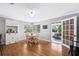Bright dining area featuring hardwood floors, built-in cabinets, and natural light streaming through large windows at 1624 Park Lake St, Orlando, FL 32803