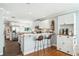 Modern eat-in kitchen featuring a peninsula, stainless steel appliances, and white cabinets for a contemporary aesthetic at 1624 Park Lake St, Orlando, FL 32803