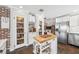 Bright kitchen featuring custom cabinets, stainless steel appliances, and ample storage including a large pantry at 1624 Park Lake St, Orlando, FL 32803