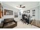 Functional home office featuring a modern desk setup, comfortable seating, and natural light at 1624 Park Lake St, Orlando, FL 32803