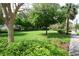 Lush green landscape featuring shade trees creating a scenic view within the Colonial Town Square at 1624 Park Lake St, Orlando, FL 32803