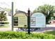 A welcome sign features information about Colontialtown, including historical facts and garden details at 1624 Park Lake St, Orlando, FL 32803