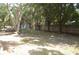 The home has a spacious backyard shaded by mature trees, perfect for enjoying nature and outdoor activities at 1644 Cypress Woods Cir, St Cloud, FL 34772