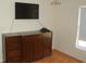 Bedroom with a large dresser, flat screen tv, and window at 1644 Cypress Woods Cir, St Cloud, FL 34772
