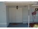 Inviting home entrance, featuring double doors, detailed trim and manicured landscaping at 1644 Cypress Woods Cir, St Cloud, FL 34772