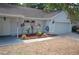 Home featuring manicured landscaping, garage and a covered entrance at 1644 Cypress Woods Cir, St Cloud, FL 34772