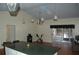Bright, open-concept kitchen and dining area, skylight, hardwood floors and neutral color palette at 1644 Cypress Woods Cir, St Cloud, FL 34772