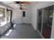 Relaxing screened porch with ceiling fans, neutral paint, and sliding doors for easy access to the outdoors at 1644 Cypress Woods Cir, St Cloud, FL 34772
