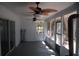 This cozy screened porch is great for relaxing and features ceiling fans and sliding glass doors at 1644 Cypress Woods Cir, St Cloud, FL 34772