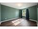 This cozy room is painted green and has vinyl flooring at 16500 Cedar Run Dr, Orlando, FL 32828