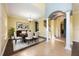 Elegant dining room features a dining table, chandelier, and decorative columns at 16500 Cedar Run Dr, Orlando, FL 32828