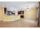 An open-concept kitchen with tile flooring, stainless steel appliances, and granite countertops at 16500 Cedar Run Dr, Orlando, FL 32828