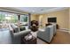 Comfortable living room with stylish furniture and a view of the patio through large sliding glass doors at 16500 Cedar Run Dr, Orlando, FL 32828