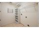 Utility room with tile flooring, shelving, and washer and dryer hookups at 16500 Cedar Run Dr, Orlando, FL 32828