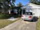 Charming home featuring a well-maintained lawn and convenient driveway parking and golf cart at 1707 E Schwartz Blvd, Lady Lake, FL 32159