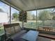 Relaxing screened-in porch overlooking the backyard is perfect for outdoor enjoyment at 1707 E Schwartz Blvd, Lady Lake, FL 32159