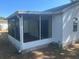Enclosed screened porch with outdoor living and dining area, accessible from the main house at 1707 E Schwartz Blvd, Lady Lake, FL 32159