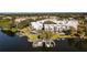 Stunning aerial view of modern townhomes with private boat docks on a serene lake at 1764 Mondrian Cir, Winter Park, FL 32789