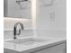 Bathroom featuring a modern faucet and a white countertop and a lighted mirror at 1764 Mondrian Cir, Winter Park, FL 32789