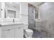 Contemporary bathroom featuring walk-in shower, toilet and lighted mirror above sink at 1764 Mondrian Cir, Winter Park, FL 32789